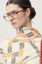Swirl gold-pleated hoop earrings