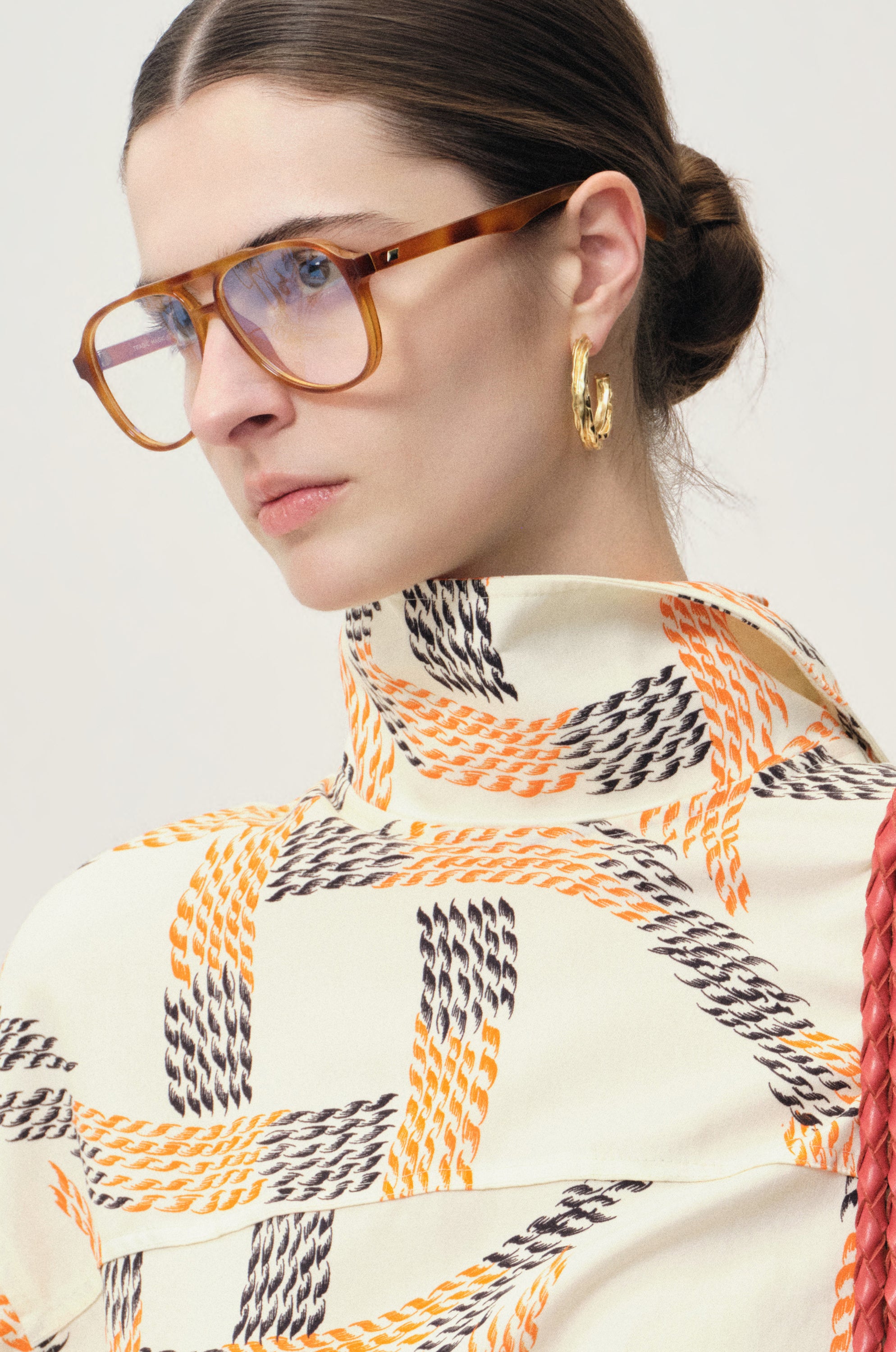 Swirl gold-pleated hoop earrings