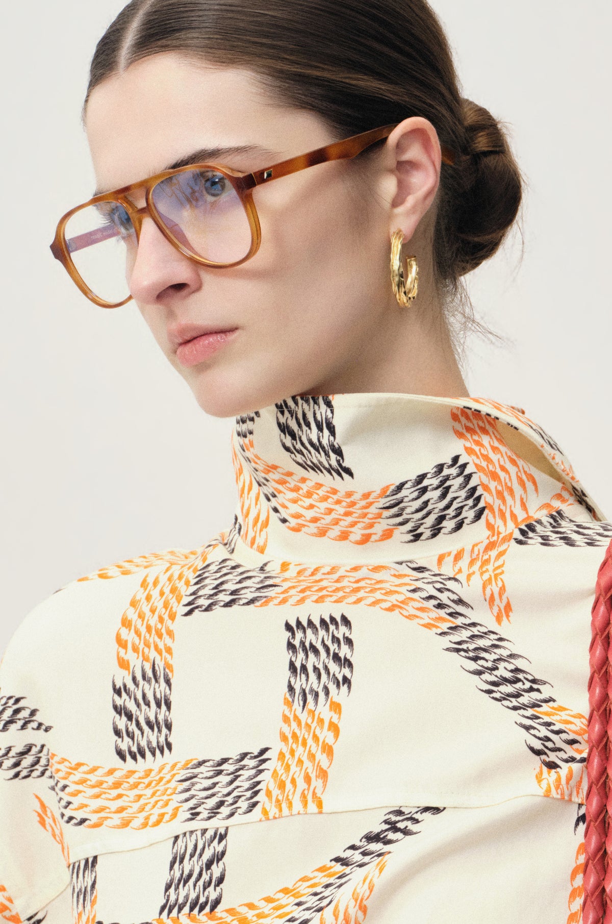 Swirl gold-pleated hoop earrings