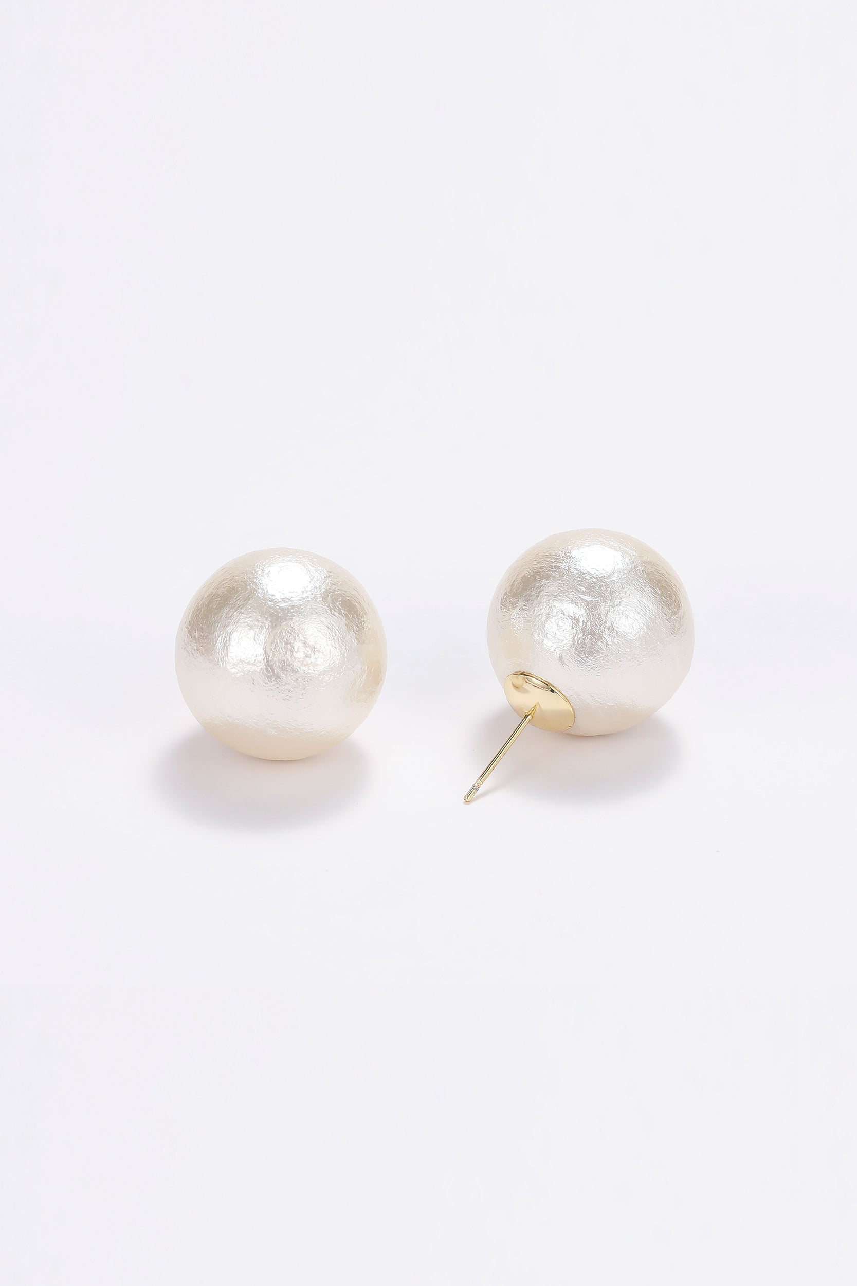 Large pearl stud earrings