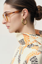 Swirl gold-pleated hoop earrings