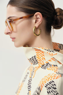 Swirl gold-pleated hoop earrings